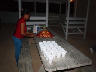 Ms. Pauline from Paradise Creations & Desires Restaurant prepares the refreshments